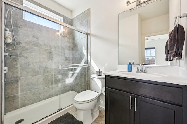 full bath with a shower stall, toilet, and vanity