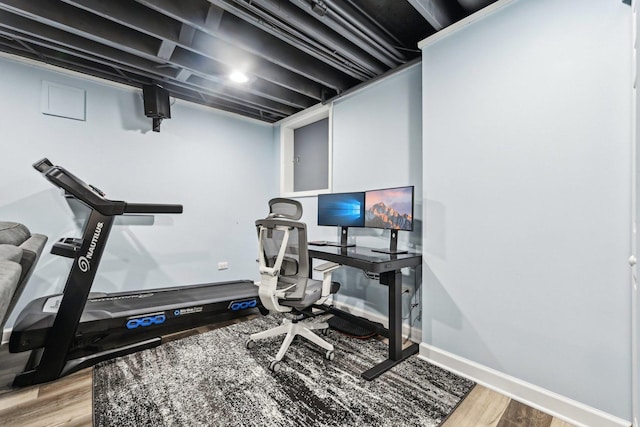 office space featuring wood finished floors and baseboards