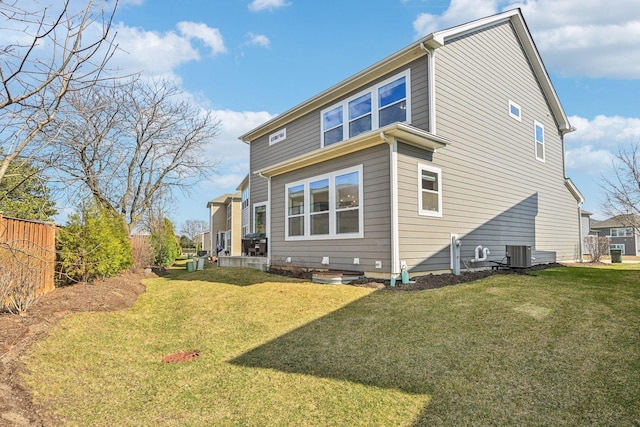 rear view of house with central AC