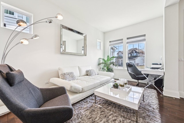 living room featuring wood finished floors and baseboards