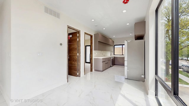 6330 Hennings Ct, Morton Grove, IL 60053 - hallway with recessed lighting, light marble finish floors, and baseboards