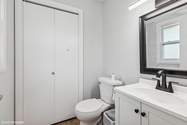 1011 Beverly Dr, Wheeling, IL 60090 - bathroom featuring toilet, vanity, and wood finished floors