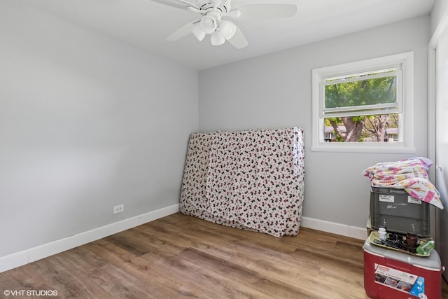 1011 Beverly Dr, Wheeling, IL 60090 - rec room featuring wood finished floors, baseboards, and a ceiling fan