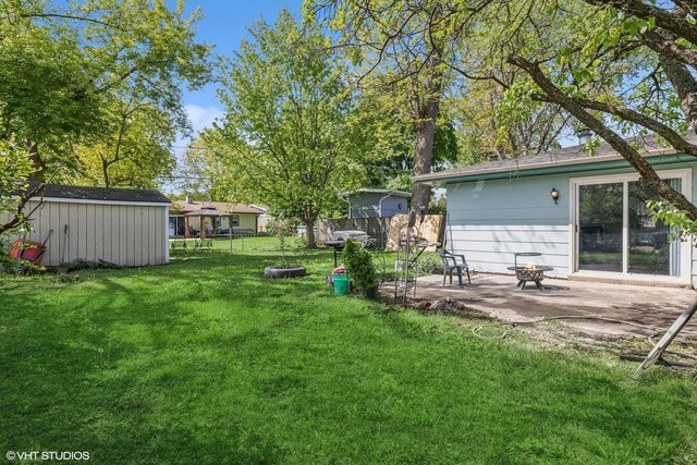 1011 Beverly Dr, Wheeling, IL 60090 - view of yard with a patio, an outdoor structure, and a storage unit