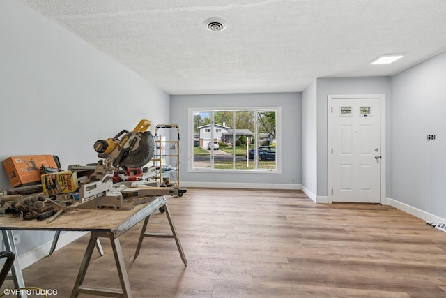 1011 Beverly Dr, Wheeling, IL 60090 - home office featuring wood finished floors, baseboards, and a textured ceiling