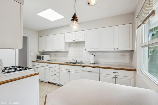 1011 Beverly Dr, Wheeling, IL 60090 - kitchen with white appliances, a sink, decorative backsplash, and white cabinetry