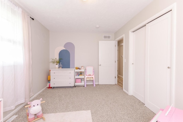 playroom featuring carpet and baseboards