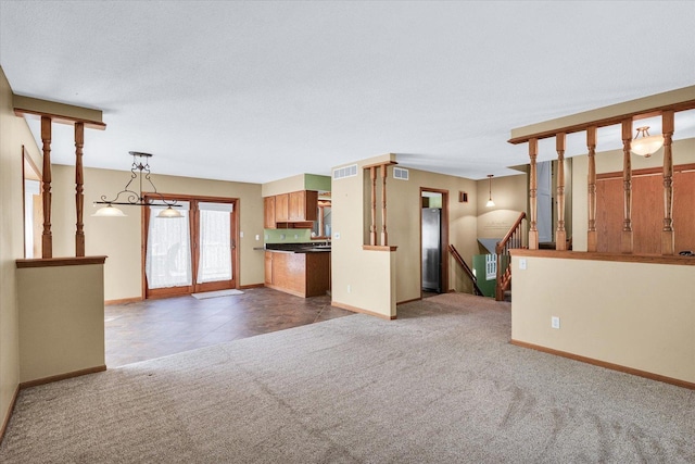 123 E 14th St, Gibson City, IL 60936 - unfurnished living room with baseboards and carpet flooring