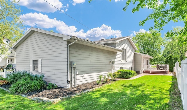 123 E 14th St, Gibson City, IL 60936 - view of side of property featuring a wooden deck and a lawn