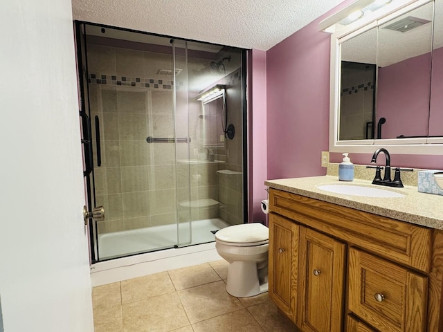 123 E 14th St, Gibson City, IL 60936 - bathroom featuring toilet, a stall shower, tile patterned floors, vanity, and a textured ceiling