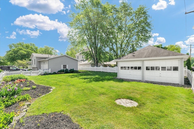 123 E 14th St, Gibson City, IL 60936 - view of yard featuring a detached garage and an outbuilding