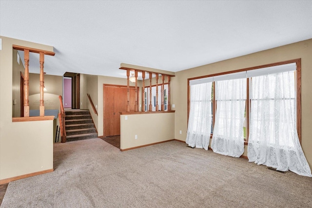 123 E 14th St, Gibson City, IL 60936 - carpeted spare room with stairway and baseboards