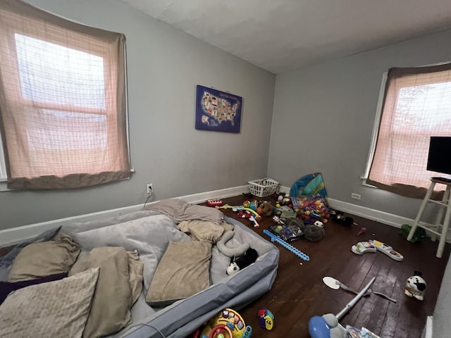 307 S 4th Ave, Kankakee, IL 60901 - bedroom with multiple windows, baseboards, and wood finished floors