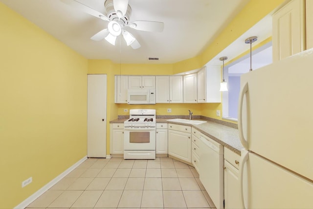 kitchen featuring white appliances, a sink, a ceiling fan, light countertops, and white cabinetry