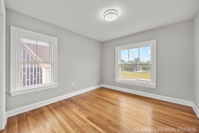 115 W Maple St, Lombard, IL 60148 - empty room with baseboards and light wood finished floors