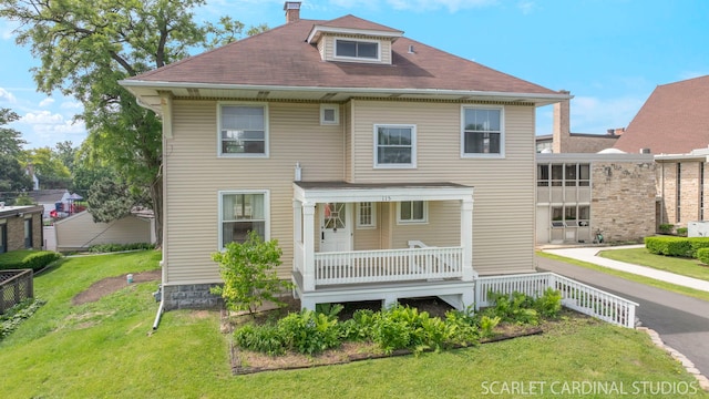 115 W Maple St, Lombard, IL 60148 - back of house with a porch, a lawn, and a chimney