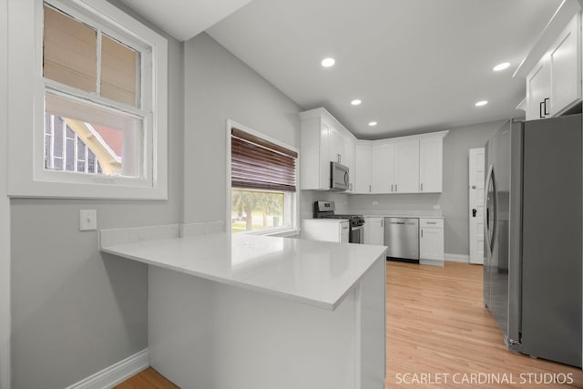 115 W Maple St, Lombard, IL 60148 - kitchen featuring appliances with stainless steel finishes, a peninsula, baseboards, white cabinetry, and recessed lighting