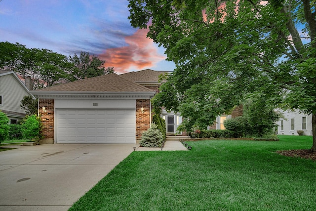 320 Brampton Ln, Arlington Heights, IL 60004 - view of front facade with a garage, concrete driveway, a front yard, brick siding, and a shingled roof