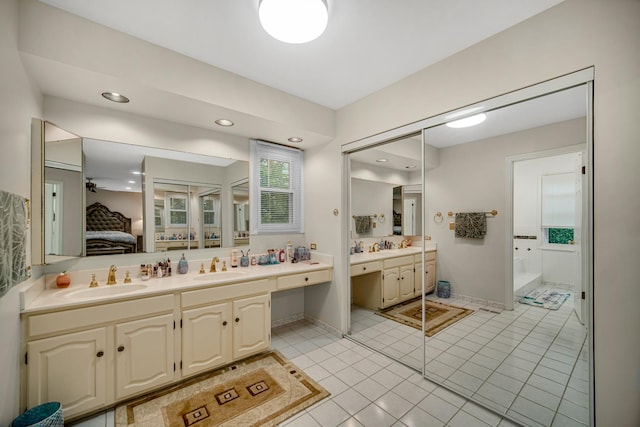 320 Brampton Ln, Arlington Heights, IL 60004 - ensuite bathroom featuring double vanity, tile patterned floors, recessed lighting, and a bathtub