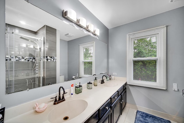 320 Brampton Ln, Arlington Heights, IL 60004 - bathroom featuring double vanity, a shower stall, healthy amount of natural light, and tile patterned floors