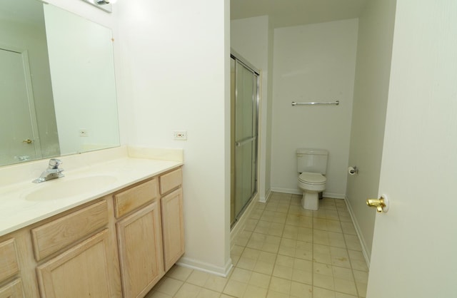 full bathroom featuring toilet, a stall shower, tile patterned flooring, and vanity