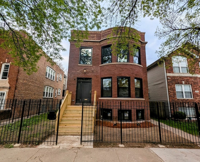 7411 S Champlain Ave, Chicago, IL 60619 - view of front of home with a fenced front yard and brick siding