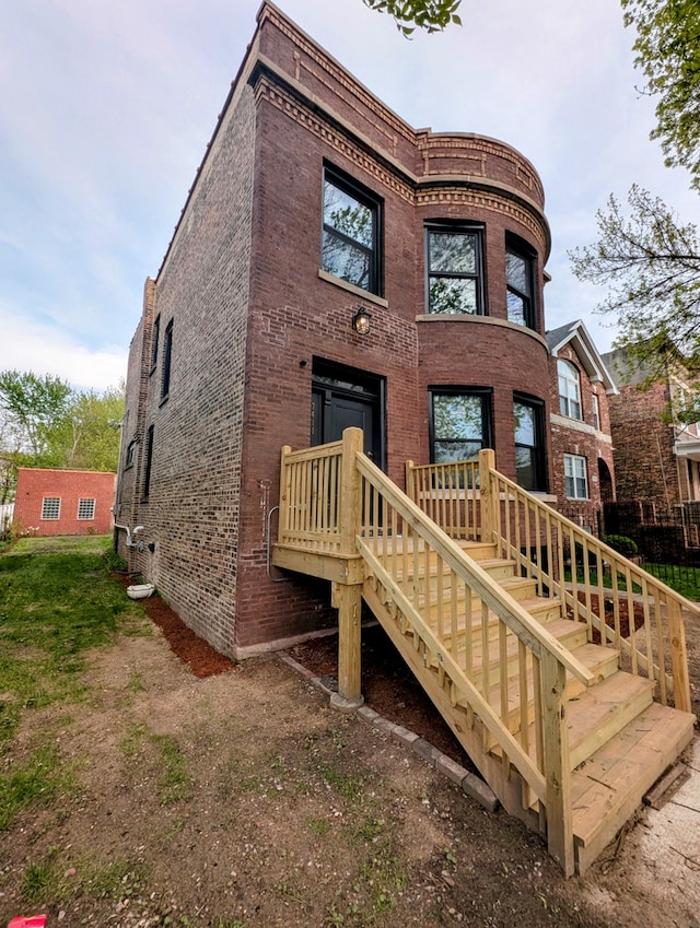 7411 S Champlain Ave, Chicago, IL 60619 - rear view of property with brick siding