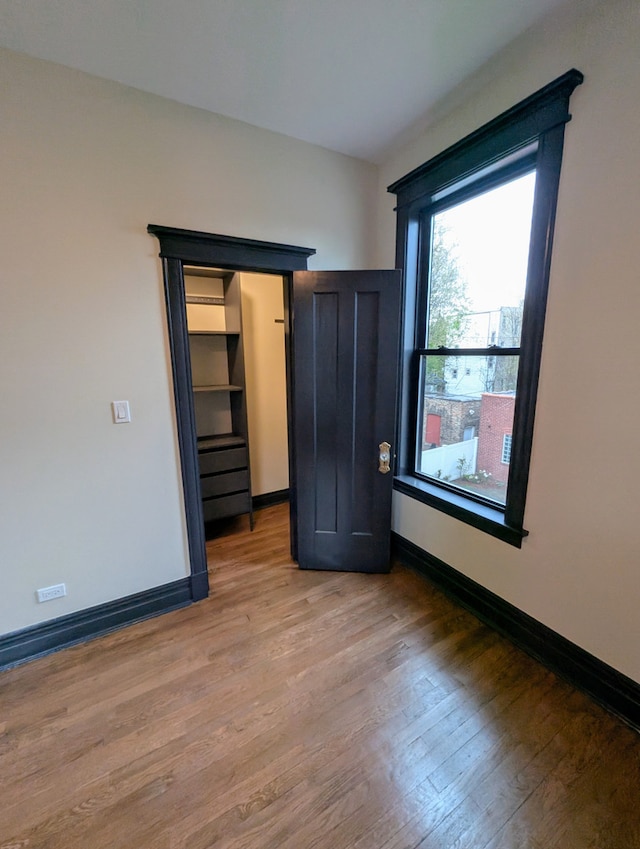 7411 S Champlain Ave, Chicago, IL 60619 - unfurnished room featuring light wood-style floors and baseboards
