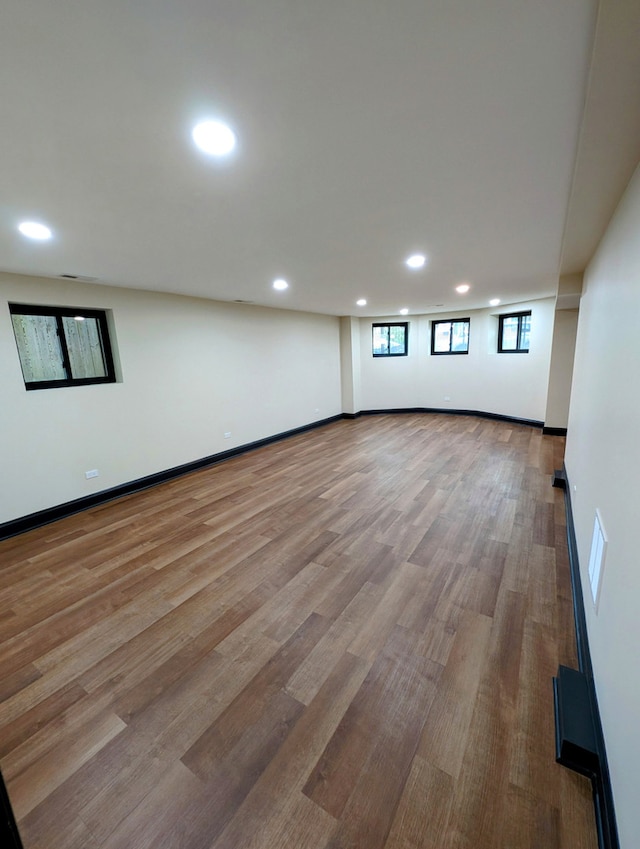7411 S Champlain Ave, Chicago, IL 60619 - below grade area with recessed lighting, wood finished floors, and baseboards