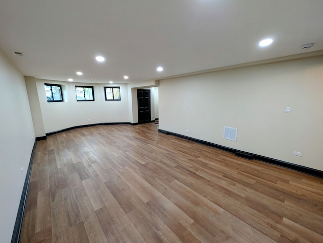 7411 S Champlain Ave, Chicago, IL 60619 - below grade area featuring light wood finished floors, recessed lighting, and baseboards