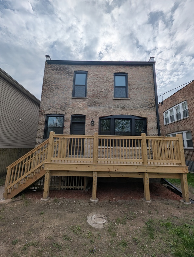 7411 S Champlain Ave, Chicago, IL 60619 - rear view of property featuring a deck and brick siding