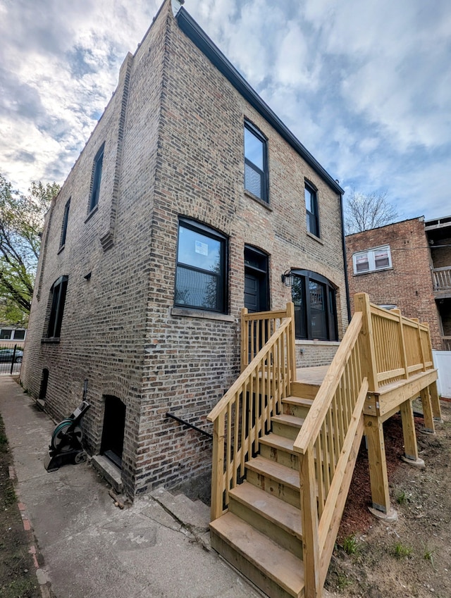 7411 S Champlain Ave, Chicago, IL 60619 - rear view of property with brick siding