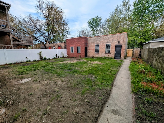 7411 S Champlain Ave, Chicago, IL 60619 - view of front of property featuring brick siding and a fenced backyard