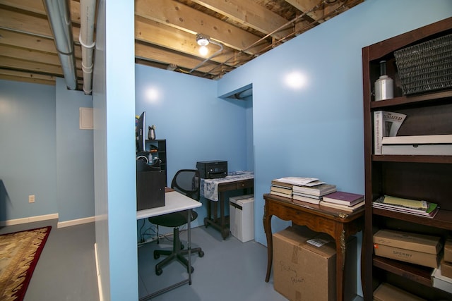 office area with concrete flooring