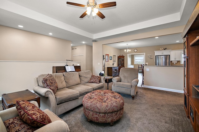 living area featuring dark carpet, a ceiling fan, and recessed lighting
