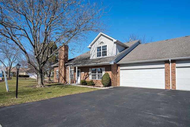 view of front of property featuring asphalt driveway, brick siding, a garage, and a front lawn