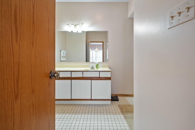 bathroom with tile patterned flooring and vanity
