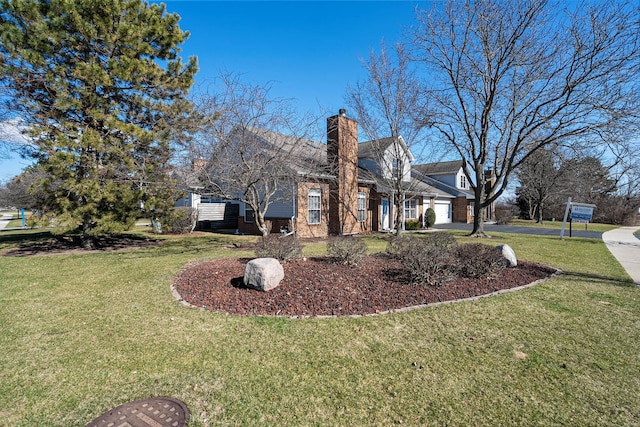 view of home's exterior featuring a yard, a chimney, brick siding, an attached garage, and driveway