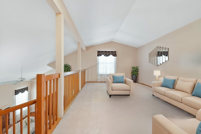 carpeted living room with vaulted ceiling and a ceiling fan