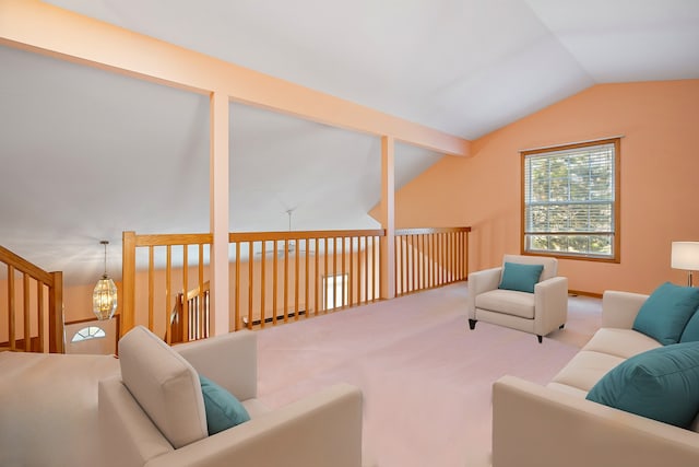 living room with lofted ceiling and carpet floors