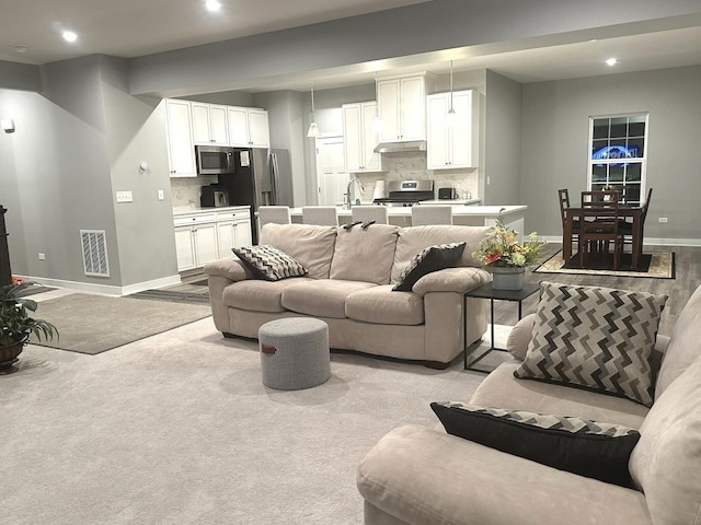 32052 N Great Plaines Ave, Lakemoor, IL 60051 - living area with baseboards, recessed lighting, and light carpet
