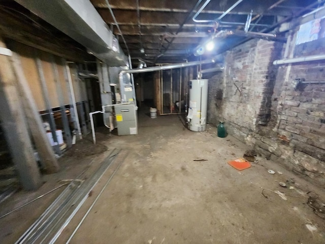 unfinished below grade area featuring water heater and heating unit