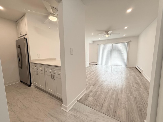 6 Villa Verde Dr Unit 102, Buffalo Grove, IL 60089 - kitchen featuring a ceiling fan, freestanding refrigerator, a baseboard radiator, recessed lighting, and a baseboard heating unit