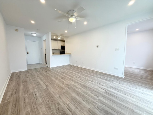 6 Villa Verde Dr Unit 102, Buffalo Grove, IL 60089 - unfurnished living room with a ceiling fan, light wood-style flooring, and recessed lighting