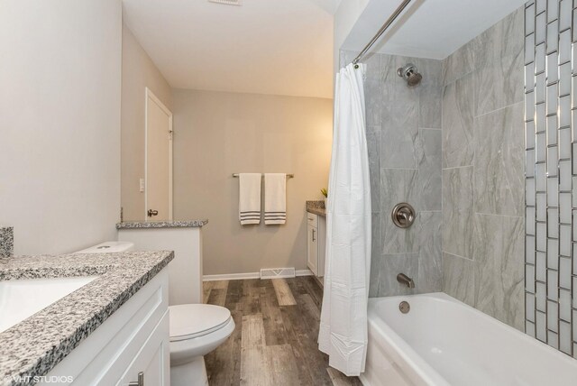 1042 Catalpa Ct, Beecher, IL 60401 - bathroom featuring vanity, wood finished floors, shower / bath combo, toilet, and baseboards