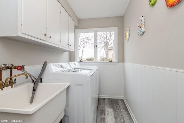 1042 Catalpa Ct, Beecher, IL 60401 - laundry area featuring wood finished floors, cabinet space, washing machine and clothes dryer, and a wainscoted wall