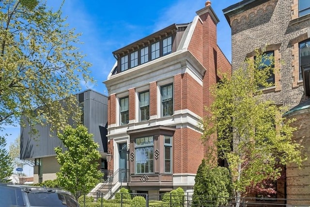 1855 N Hermitage Ave, Chicago, IL 60622 - view of front of property featuring brick siding and a fenced front yard