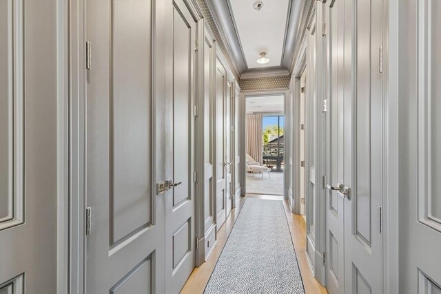 1855 N Hermitage Ave, Chicago, IL 60622 - hallway with crown molding and light wood-type flooring