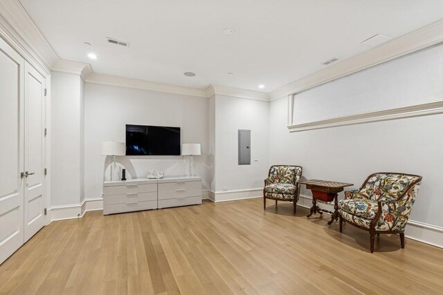 1855 N Hermitage Ave, Chicago, IL 60622 - living area with light wood-style flooring, ornamental molding, baseboards, electric panel, and recessed lighting