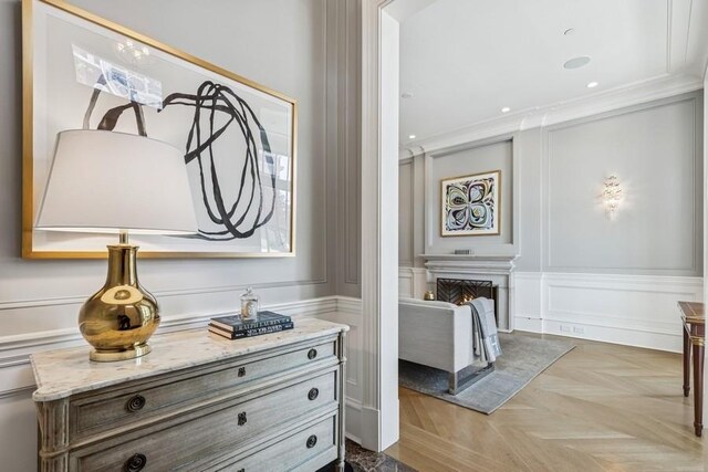 1855 N Hermitage Ave, Chicago, IL 60622 - bathroom featuring a decorative wall, vanity, ornamental molding, a warm lit fireplace, and recessed lighting